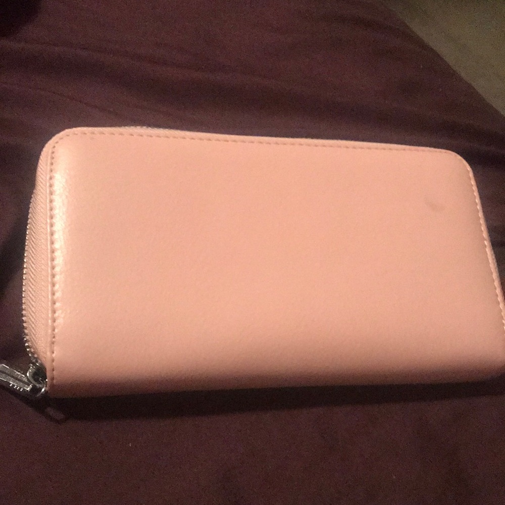 Pink zip around credit card wallet